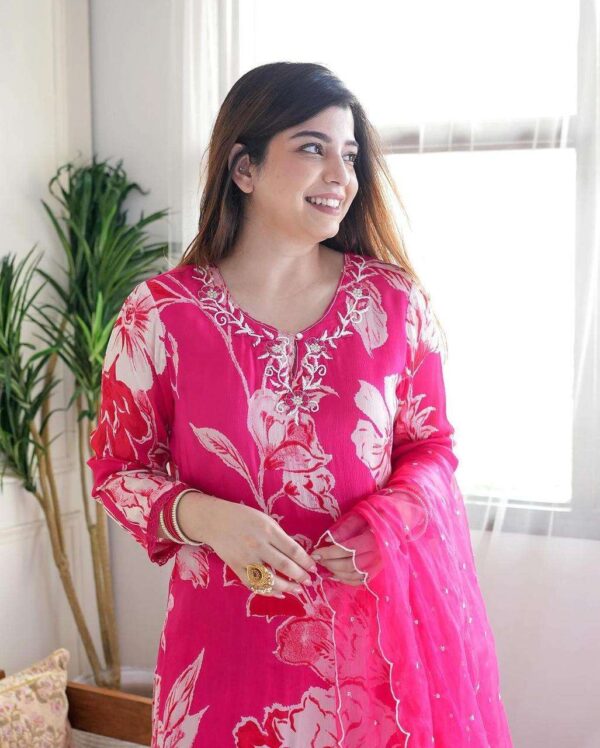 outfit consists of a long flowing kurta a matching bottom and a sheer dupatta - Image 3