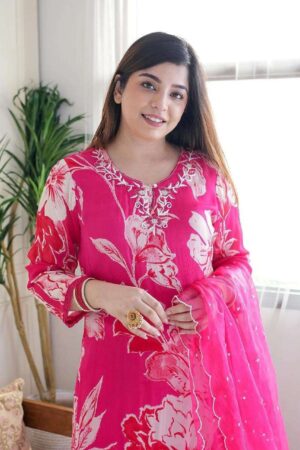 outfit consists of a long flowing kurta a matching bottom and a sheer dupatta